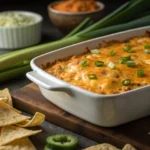 Buffalo chicken dip with cottage cheese served with chips and celery – perfect game day appetizer