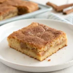 Close-up of a single Chewy Snickerdoodle Cookie Bar with cinnamon sugar crackle top