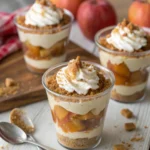 Close-up of Caramel Apple Dessert Cups layered with caramel, apples, and whipped cream in glass cups – the perfect fall dessert.